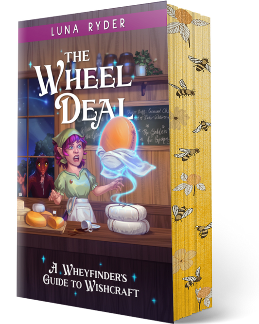The Wheel Deal: A Wheyfinder's Guide to Wishcraft book by Luna Ryder, shown as a 3D book mockup with a detailed fantasy illustration on the front cover and a yellow spine decorated with whimsical bees.